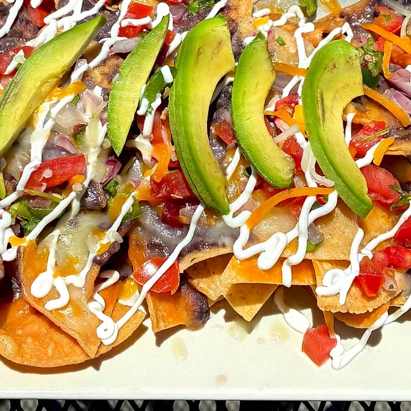 Avocado fans and crema up close on the World Cup nacho plate