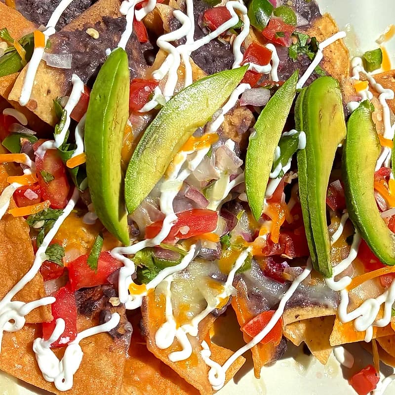 Fresh chips, black beans, and pico de gallo on the World Cup nacho plate